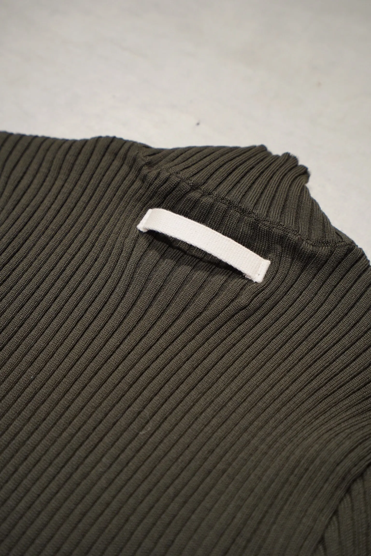 UNIFORME FUNNEL NECK MERINO WOOL SWEATER