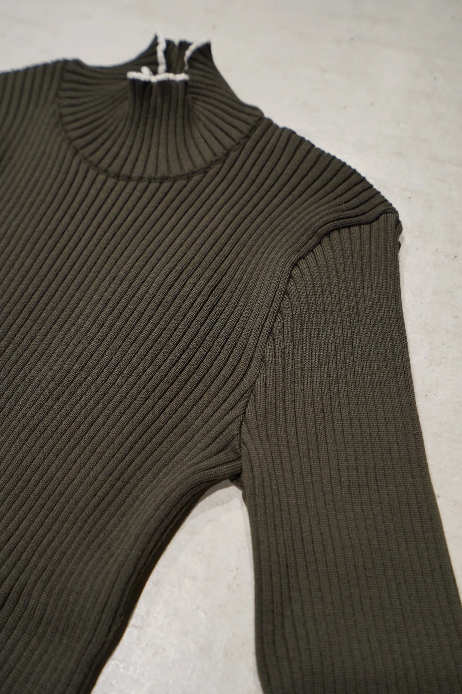 UNIFORME FUNNEL NECK MERINO WOOL SWEATER